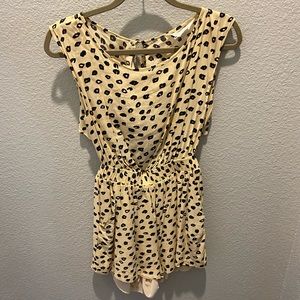 Backless beige romper with black dots
